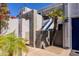 Condominium building with a desert style landscape and blue stairs at 902 W Glendale Ave # 115, Phoenix, AZ 85021