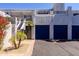 Condominiums with blue doors, palm trees, and desert landscaping at 902 W Glendale Ave # 115, Phoenix, AZ 85021