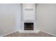 Corner fireplace with modern white tile and black accents for a contemporary design at 902 W Glendale Ave # 115, Phoenix, AZ 85021