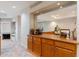 Stylish living room featuring custom cabinetry and a large mirror, enhancing the space at 902 W Glendale Ave # 115, Phoenix, AZ 85021