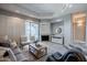 Bright living room with sliding doors, neutral tones and a fireplace, creating an inviting atmosphere at 902 W Glendale Ave # 115, Phoenix, AZ 85021