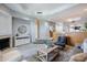Spacious living room with a fireplace, cozy seating area and easy access to other living spaces at 902 W Glendale Ave # 115, Phoenix, AZ 85021