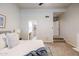 Bright main bedroom featuring a ceiling fan, an ensuite bathroom, and walk-in closet at 902 W Glendale Ave # 115, Phoenix, AZ 85021