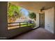 A covered patio featuring a ceiling fan and security door overlooking a low maintenance backyard at 902 W Glendale Ave # 115, Phoenix, AZ 85021