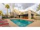 Community pool area featuring lounge chairs and shade canopies at 902 W Glendale Ave # 115, Phoenix, AZ 85021