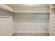 Spacious walk-in closet with ample hanging space and built-in drawers at 902 W Glendale Ave # 115, Phoenix, AZ 85021