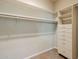 Spacious walk-in closet with ample hanging space and built-in drawers at 902 W Glendale Ave # 115, Phoenix, AZ 85021