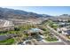 Aerial view of community clubhouse, pool, walking paths and mountain views at 1127 E Mcneil St, Phoenix, AZ 85042