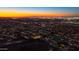 Dusk aerial view of neighborhood homes, street lights, and mountain backdrop at 1127 E Mcneil St, Phoenix, AZ 85042