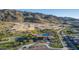 Aerial view of community with clubhouse, pool and new home construction at 1127 E Mcneil St, Phoenix, AZ 85042
