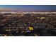 Twilight aerial view of valley homes and mountain backdrop at 1127 E Mcneil St, Phoenix, AZ 85042