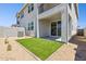 Backyard features well kept artificial grass and covered patio, perfect for relaxing at 1127 E Mcneil St, Phoenix, AZ 85042