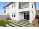 A backyard features a modern patio, turf, block wall, and second-story balcony at 1127 E Mcneil St, Phoenix, AZ 85042