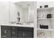 Contemporary bathroom with double vanity sinks, shelving, and modern decor at 1127 E Mcneil St, Phoenix, AZ 85042