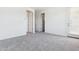Bright, neutral bedroom featuring plush carpeting, and multiple closets at 1127 E Mcneil St, Phoenix, AZ 85042