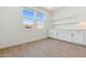 Bonus room featuring modern cabinets, quartz countertops, and abundant natural light at 1127 E Mcneil St, Phoenix, AZ 85042