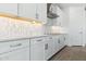 Modern kitchen boasts stylish under cabinet lighting and light countertops at 1127 E Mcneil St, Phoenix, AZ 85042