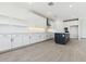 Open kitchen boasts recessed lighting, backsplash, and spacious countertops at 1127 E Mcneil St, Phoenix, AZ 85042
