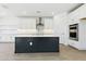 Kitchen with island, stainless steel appliances, and quartz countertops at 1127 E Mcneil St, Phoenix, AZ 85042
