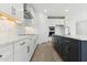 Modern kitchen showcasing a dark island, stainless steel appliances, and backsplash at 1127 E Mcneil St, Phoenix, AZ 85042