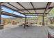 Covered picnic area features modern pergola and built-in concrete benches and picnic tables at 1127 E Mcneil St, Phoenix, AZ 85042