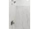 Modern shower with marble-style tile and brushed nickel hardware at 1127 E Mcneil St, Phoenix, AZ 85042
