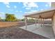 Extended covered patio in large backyard creates an inviting space for relaxation at 1227 W Avalon Canyon Dr, Casa Grande, AZ 85122