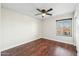 Clean bedroom with ceiling fan and natural light from the window at 1227 W Avalon Canyon Dr, Casa Grande, AZ 85122