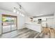 Modern kitchen featuring white cabinets, updated appliances, and easy access to an outdoor space at 1227 W Avalon Canyon Dr, Casa Grande, AZ 85122