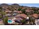 Beautiful aerial view showing a pool and mature landscaping and a desert mountain backdrop at 1327 E Le Marche Ave, Phoenix, AZ 85022