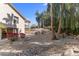 Expansive yard featuring mature trees, desert landscaping, and a charming two-story home at 1327 E Le Marche Ave, Phoenix, AZ 85022