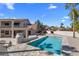 Spacious backyard features a refreshing pool, stucco walls, desert landscaping, and a covered patio at 1327 E Le Marche Ave, Phoenix, AZ 85022