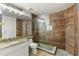 Updated bathroom featuring granite counters, glass shower and modern tiling throughout at 1327 E Le Marche Ave, Phoenix, AZ 85022