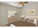 Bedroom showcasing a dresser, a neutral color scheme, and a comfortable bed at 1327 E Le Marche Ave, Phoenix, AZ 85022