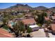 Charming exterior view of a well-maintained home with lush landscaping and a sparkling pool at 1327 E Le Marche Ave, Phoenix, AZ 85022