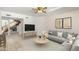 Bright living room with a neutral palette, light tile floors, modern furnishings, and cozy seating area at 1327 E Le Marche Ave, Phoenix, AZ 85022