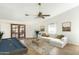 Bright and spacious living room featuring a billiards table and sliding door access to the outside at 1327 E Le Marche Ave, Phoenix, AZ 85022