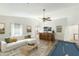 Spacious living room adjacent to billiards room, wet bar and comfortable seating at 1327 E Le Marche Ave, Phoenix, AZ 85022