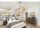 This main bedroom has great natural light, a ceiling fan and an ensuite closet for extra storage at 1327 E Le Marche Ave, Phoenix, AZ 85022