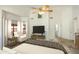 Bright main bedroom featuring a ceiling fan, chair, and furnishings at 1327 E Le Marche Ave, Phoenix, AZ 85022