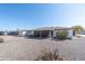 Charming home with a shaded patio, desert landscaping, and low-maintenance backyard at 136 N 63Rd St, Mesa, AZ 85205