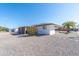Charming home with a shaded patio, desert landscaping, and low-maintenance backyard at 136 N 63Rd St, Mesa, AZ 85205