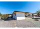 Charming home with a shaded patio, desert landscaping, and low-maintenance backyard at 136 N 63Rd St, Mesa, AZ 85205
