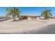 Charming single-story home with desert landscaping and a convenient covered carport at 136 N 63Rd St, Mesa, AZ 85205