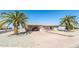 Charming single-story home with desert landscaping and a convenient covered carport at 136 N 63Rd St, Mesa, AZ 85205