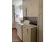 Functional laundry room with washer, dryer, and ample cabinet space at 136 N 63Rd St, Mesa, AZ 85205