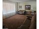 Bright living room featuring a large window letting in natural light and a comfortable seating area at 136 N 63Rd St, Mesa, AZ 85205