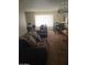Open concept living room with a dining area, window, and chandelier at 136 N 63Rd St, Mesa, AZ 85205