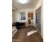 Home office with a desk, comfortable seating, and natural light, perfect for productivity at 136 N 63Rd St, Mesa, AZ 85205