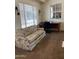 Bright office with a cozy couch, large windows and functional desk space at 136 N 63Rd St, Mesa, AZ 85205